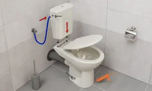 Montaż toalety z odpływem WC w podłodze. Widać wąż doprowadzający wodę, klucze i pistolet do silikonu.