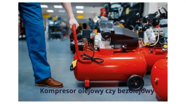 Czerwony kompresor olejowy czy bezolejowy? Mężczyzna w niebieskich spodniach przygotowuje się do pracy z urządzeniem.